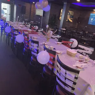 tables and chairs set for a party