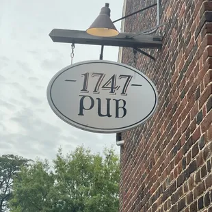 a sign on a brick building