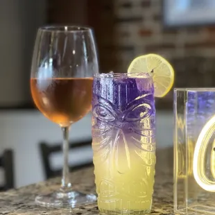 Rosė wine and a Tiki Empress cocktail.