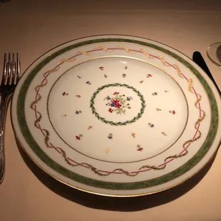 The plate they take away after you sit down.