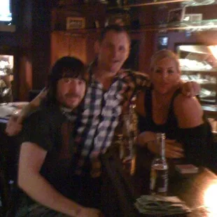 a group of friends sitting at a bar