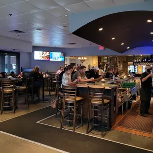 customers sitting at the bar