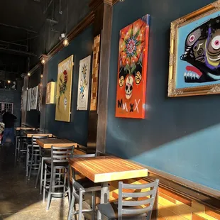 Artwork and seating along the wall during the day