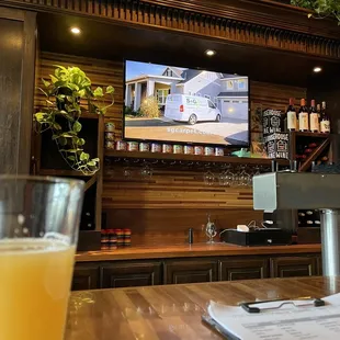 a television and a glass of orange juice