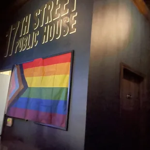 a rainbow flag on the wall