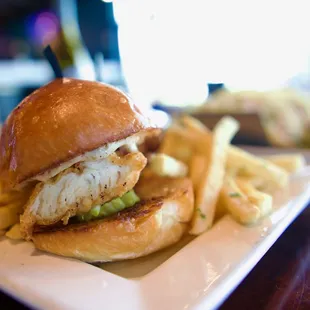 a fish sandwich and french fries