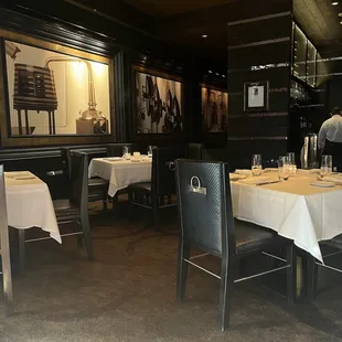 a dining room with tables and chairs