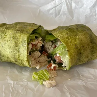 Awesome stuffed Chicken Caesar Wrap on spinach tortilla.