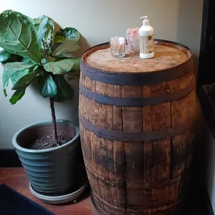 a wooden barrel and potted plant