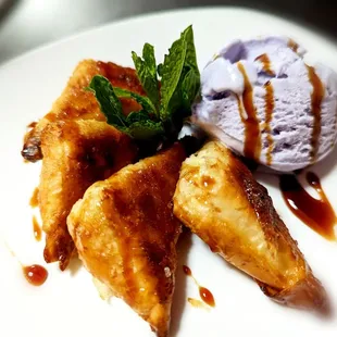 Goat cheese and honey stuffed puff pastry paired with lavender ice cream and date syrup.