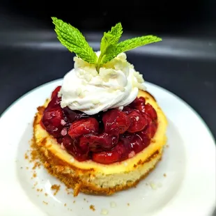 Mini Ricotta Cheesecake.  GF Toasted almond crust and a Brandied Cherry-Berry compote.