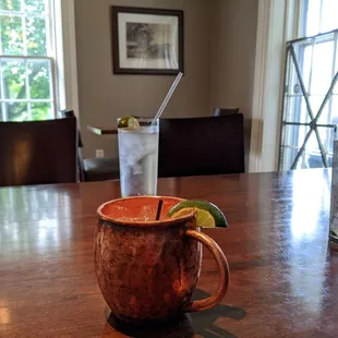 a moscow mule with a lime garnish on the rim