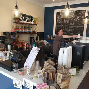 a woman standing at the counter