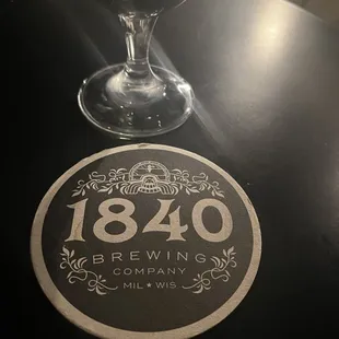 a glass of beer on a table