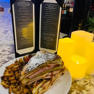 a plate of french fries and a sandwich