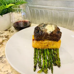 a steak and asparagus on a plate