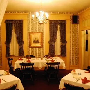 a dining room with tables and chairs