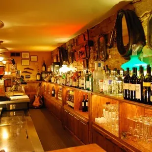a bar with many bottles of wine