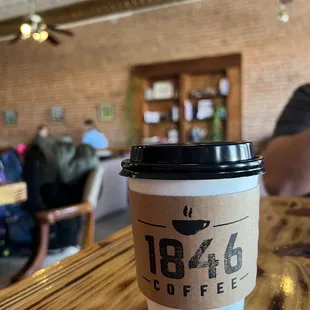 a cup of coffee on a table