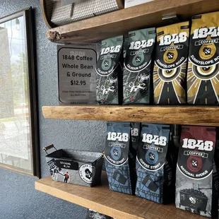 a shelf of coffee beans and coffee bags