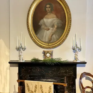 Portrait panting above the fireplace in the main bedroom of the 1850 House of the Louisiana State Museum