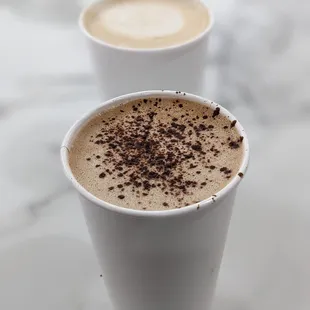 two cups of coffee on a table