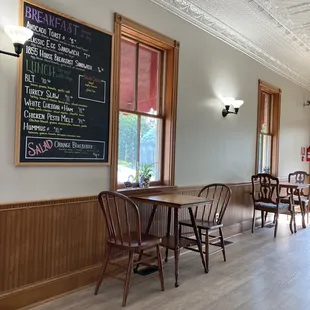 tables, chairs, and menu board