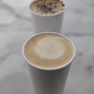 two cups of coffee on a table