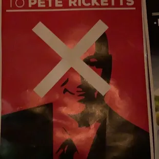 a poster of a man in a suit and tie