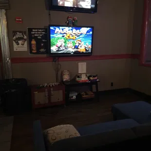 a living room with a flat screen tv