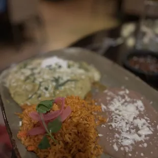 Shrimp enchiladas with rice and beans