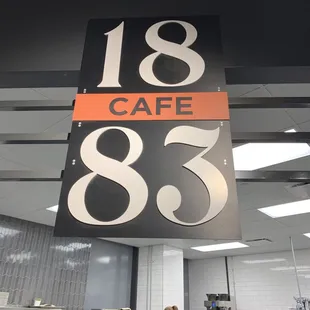 a woman at a counter in a restaurant