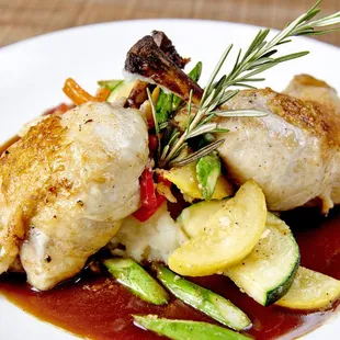 Rosemary Chicken - Garlic rosemary roasted chicken served with bordelaise, roasted grlic mashed potatoes, and mixed vegetables.
