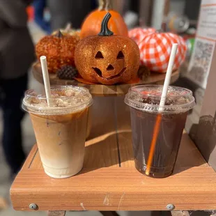 a pumpkin and iced coffee