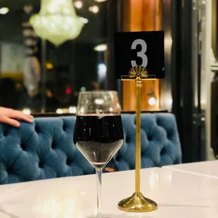 a glass of wine on a table