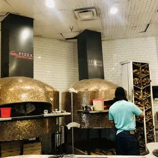 a woman working in a kitchen