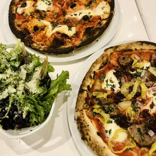 two pizzas and a salad