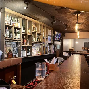 a bar with a lot of bottles