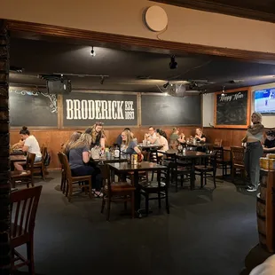 people sitting at tables in a restaurant