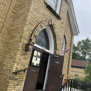 the entrance to a brick building