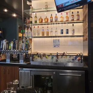 a bar with a television on the wall