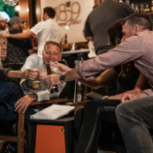 a group of people enjoying a drink