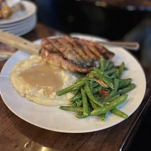 Porkchop with honey garlic glaze, mashed potato with gravy and green beans