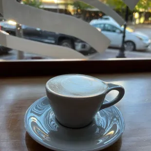 a cup of coffee on a saucer