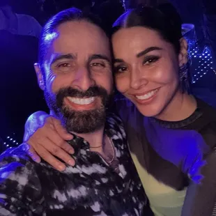a man and woman taking a selfie