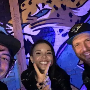 three people posing for a picture