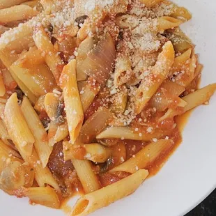 a plate of pasta with meat and cheese