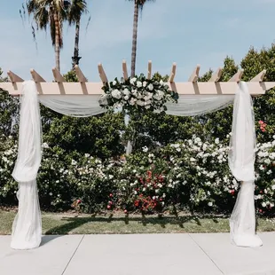 a wedding arch decorated with flowers