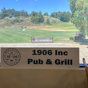 Interior signage with view of driving range