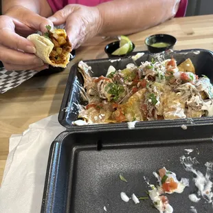 Taco and carnitas nachos!  Partially gone because they were too good to wait!